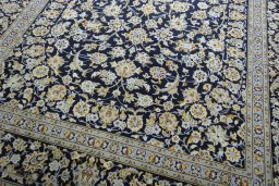 Close-up detail of 2000s Kashan rug from Iran / Persia showing Wool weave