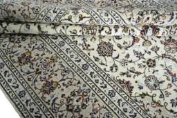 Close-up detail of 2000s Kashan rug from Iran / Persia showing Wool weave