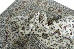 Surface texture of 2000s Kashan rug with natural Wool and intricate pattern