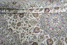 Close-up detail of 2000s Kashan rug from Iran / Persia showing Wool weave