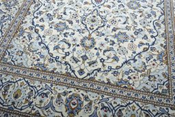 Close-up detail of 2000s Kashan rug from Iran / Persia showing Wool weave