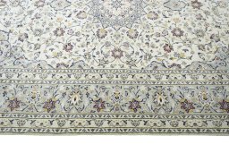 Corner detail of New Kashan rug showing border pattern and Wool pile