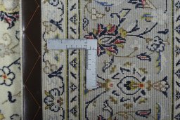 Backside of handmade New Kashan rug showing knot structure and weave density