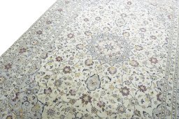 Backside of handmade New Kashan rug showing knot structure and weave density