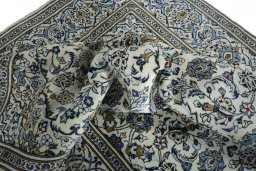 Surface texture of 2000s Kashan rug with natural Wool and intricate pattern