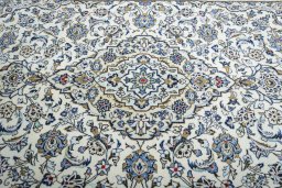 Central medallion detail of 2000s Kashan rug from Iran / Persia