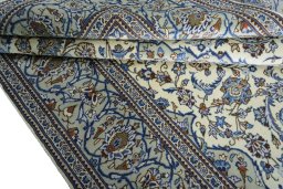 Close-up detail of 2000s Kashan rug from Iran / Persia showing Wool weave