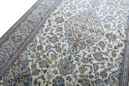 Backside of handmade 2000s Kashan rug showing knot structure and weave density