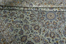 Close-up detail of 2000s Kashan rug from Iran / Persia showing Wool weave