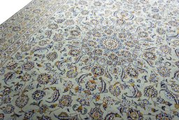 Backside of handmade 2000s Kashan rug showing knot structure and weave density