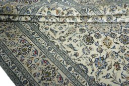Close-up detail of 2000s Kashan rug from Iran / Persia showing Wool weave