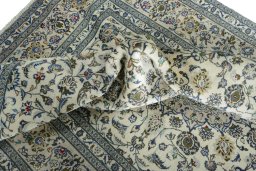 Surface texture of 2000s Kashan rug with natural Wool and intricate pattern