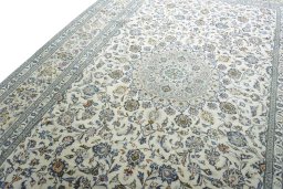 Backside of handmade 2000s Kashan rug showing knot structure and weave density