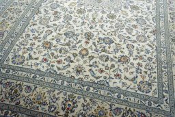 Close-up detail of 2000s Kashan rug from Iran / Persia showing Wool weave