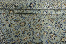 Close-up detail of 2000s Kashan rug from Iran / Persia showing Wool weave