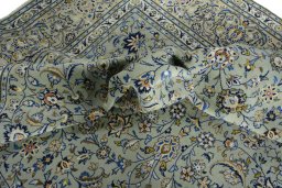 Surface texture of 2000s Kashan rug with natural Wool and intricate pattern