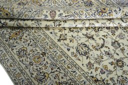 Close-up detail of 2000s Kashan rug from Iran / Persia showing Wool weave