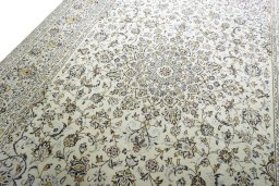 Backside of handmade 2000s Kashan rug showing knot structure and weave density