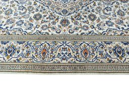 Corner detail of 2000s Kashan rug showing border pattern and Wool pile
