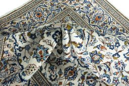 Surface texture of 2000s Kashan rug with natural Wool and intricate pattern