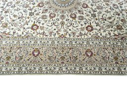 Corner detail of New Kashan rug showing border pattern and Wool pile