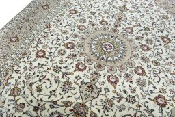 Backside of handmade New Kashan rug showing knot structure and weave density