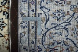 Backside of handmade 2000s Kashan rug showing knot structure and weave density