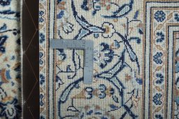 Backside of handmade New Kashan rug showing knot structure and weave density