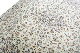Backside of handmade New Kashan rug showing knot structure and weave density