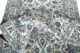 Close-up detail of 2000s Kashan rug from Iran / Persia showing Wool weave