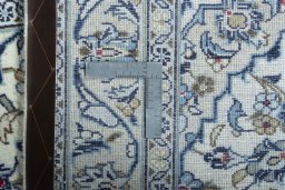Surface texture of 2000s Kashan rug with natural Wool and intricate pattern