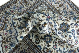 Surface texture of 2000s Kashan rug with natural Wool and intricate pattern
