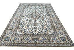 Surface texture of 2000s Kashan rug with natural Wool and intricate pattern