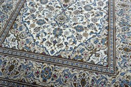 Close-up detail of 2000s Kashan rug from Iran / Persia showing Wool weave