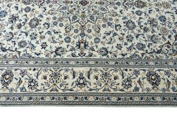 Corner detail of New Kashan rug showing border pattern and Wool pile