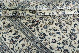 Close-up detail of New Kashan rug from Iran / Persia showing Wool weave