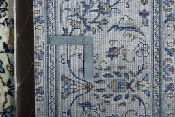 Backside of handmade New Kashan rug showing knot structure and weave density