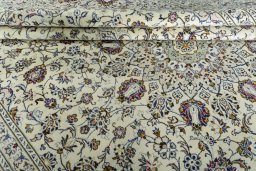 Close-up detail of 2000s Kashan rug from Iran / Persia showing Wool weave