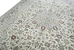 Backside of handmade 2000s Kashan rug showing knot structure and weave density