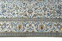 Corner detail of 2000s Kashan rug showing border pattern and Wool pile
