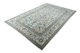 Corner detail of 2000s Kashan rug showing border pattern and Wool pile