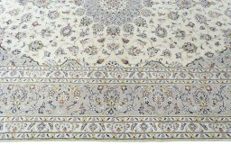 Corner detail of 2000s Kashan rug showing border pattern and Wool pile