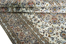 Close-up detail of 2000s Kashan rug from Iran / Persia showing Wool weave