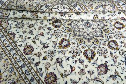 Close-up detail of 2000s Kashan rug from Iran / Persia showing Wool weave