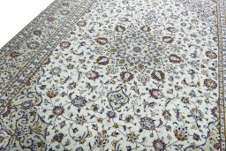 Backside of handmade 2000s Kashan rug showing knot structure and weave density