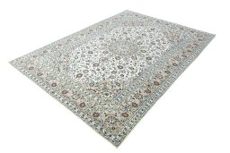 Corner detail of 2000s Kashan rug showing border pattern and Wool pile