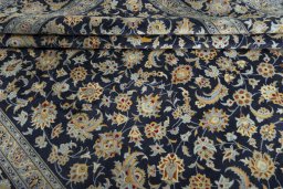 Close-up detail of 2000s Kashan rug from Iran / Persia showing Wool weave