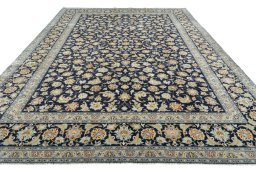Surface texture of 2000s Kashan rug with natural Wool and intricate pattern