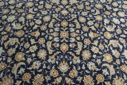 Central medallion detail of 2000s Kashan rug from Iran / Persia
