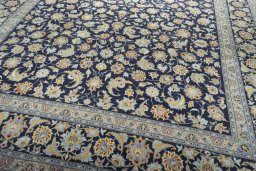 Close-up detail of 2000s Kashan rug from Iran / Persia showing Wool weave